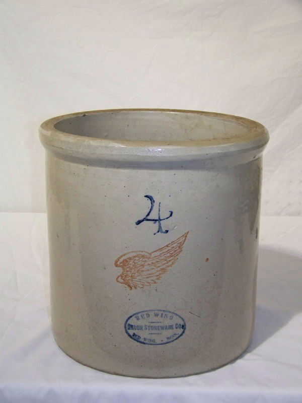 Antique Red Wing #4 Crock W/Large Red Wing in Cent: Antique Red Wing #4 Crock W/Large Red Wing in Center. Red Wing Union Stoneware Co. Red Wing, Minn on front of crock. Stands 11 3/4" tall and 11 7/8" across top.