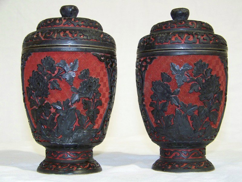 Pair Early Chinese Cinnabar Lidded Vase's: Pair Early Chinese Cinnabar Lidded Vase's. Each app. 6" tall. Great carving of flowers with rocks.