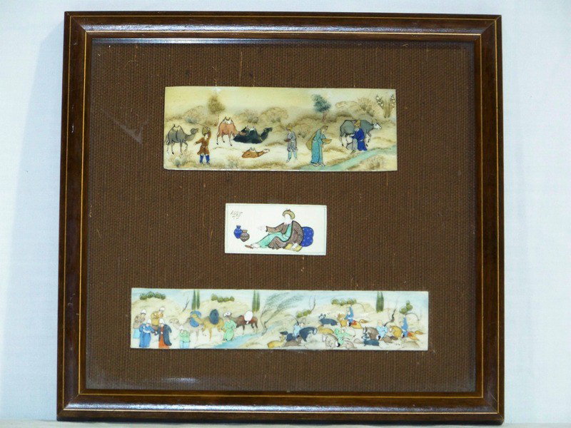 3 Early Persian Ivory Plaques of Persian Life " Sig: 3 Early Persian Ivory Plaques of Persian Life " Signed", in a inlaid frame.Middle one is signed of a man with baskets, top one is of Camels and people at stream, bottom on is of Camels, Horses and peo