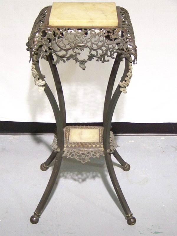 Early French Carved Iron Marble Top Stand: Early French Carved Marble Top Stand.Great ornate carved two tier stand with a marble top and base resting on round brass feet. Stands app 33 1/2" tall and 15 1/2" x 15 1/2" top. Has floral carving th
