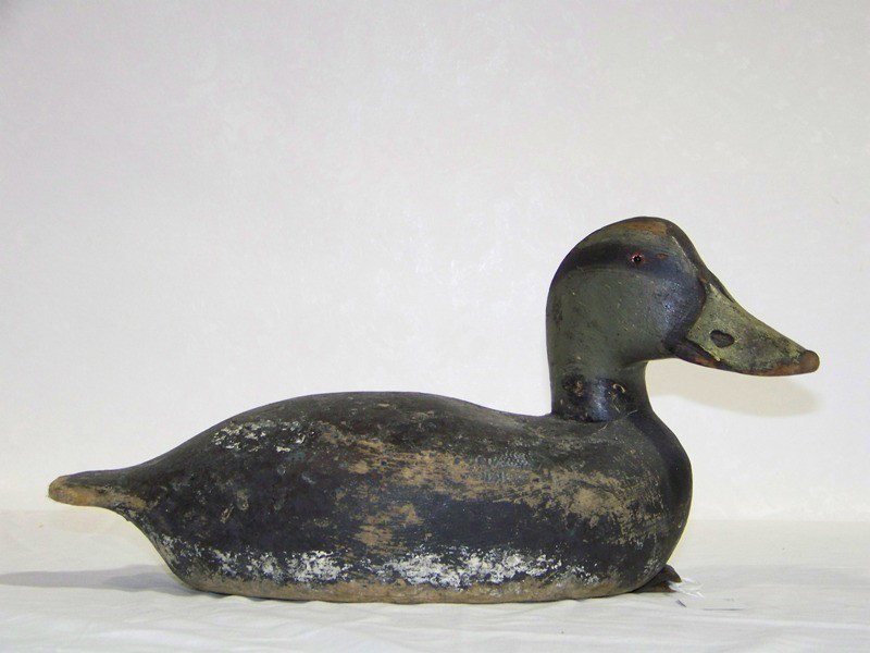 Antique Wood Carved Duck Decoy, Glass Eyes: Antique Wood Carved Duck Decoy, Glass Eyes.Has a leather strap on base. App. 15" long 7 3/4" tall and app. 6" deep. Not signed.