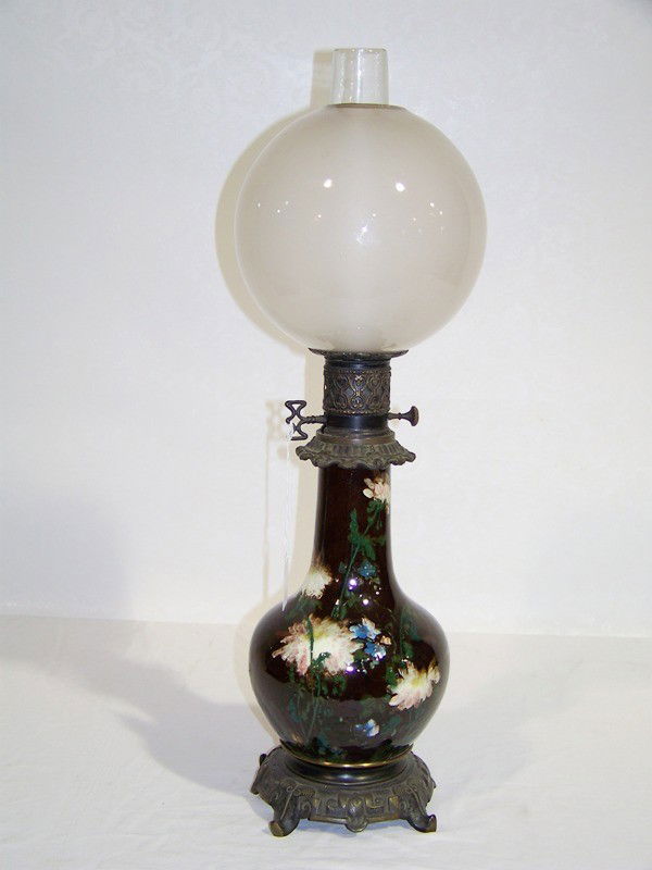 Early Weller Art Pottery Oil Lamp: Early Weller?? Art Pottery Oil Lamp. Great hand painted pottery oil lamp now electric, with chimney and globe.App. 23" tall to top of chimney.Hand painted with flowers and resting in a metal base.