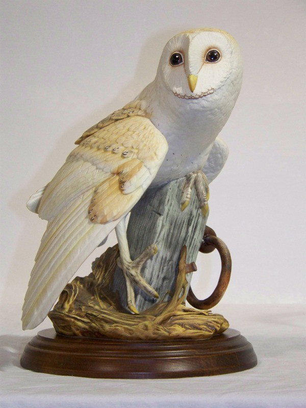 George McMonigle Porcelain Barn Owl: George McMonigle Porcelain Barn Owl. Great porcelain Barn Owl by George McMonigle for the Franklin Mint, stands app. 10 1/4" tall, has wooden base and Certificate of Authenticity.