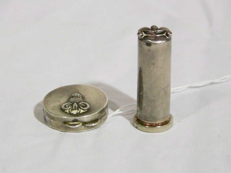 2 Pc Georg Jensen Sterling Lipstick & Compact: 2 Pc Georg Jensen Sterling Lipstick & Compact with pineapple design. Lipstick 2" tall, stamped Georg Jensen Inc. USA Sterling. Compact 1.25" across, stamped Sterling. Total weight 1.44 troy ounces.