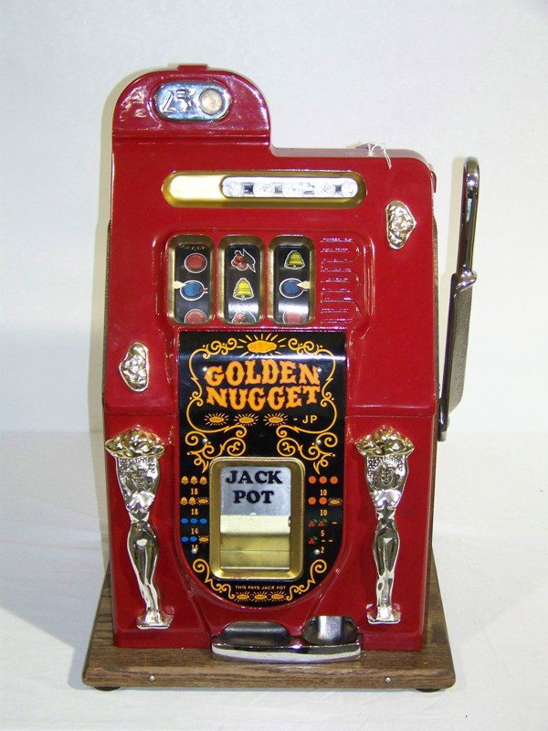 MILL’S 1948 GOLDEN NUGGET QUARTER SLOT MACHINE: MILL’S 1948 GOLDEN NUGGET QUARTER SLOT MACHINE.rnThis slot machine is remanufactured to their original state using as many original components as possible. Any replacement parts have been remade fro