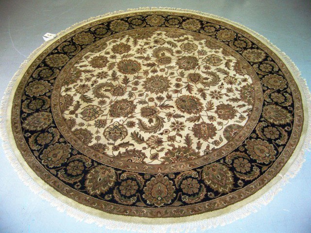 Vintage India Agra 8' Round Hand Made Rug: Vintage India Agra 8' Round Hand Made Rug.In black,creams,reds and greens.