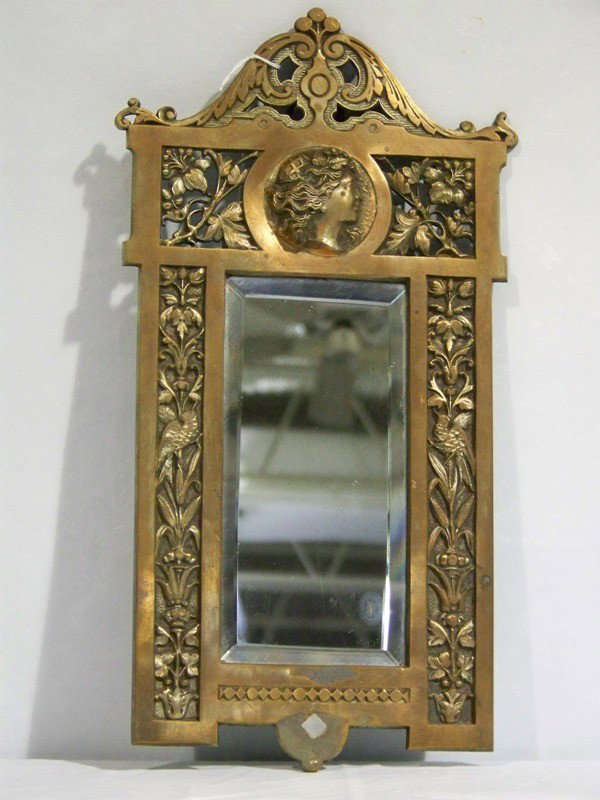 Antique Bronze & Steel Art Deco Figural Beveled Mir: Antique Bronze & Steel Art Deco Figural Beveled Mirror. Great pc. with a figural head medallion and floral and birds on sides. 15 1/4" tall and 8" wide.Has rub at bottom.