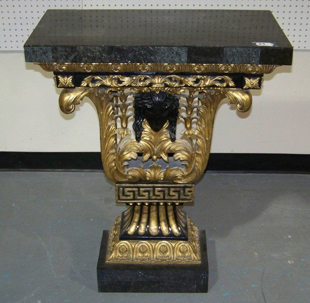 Vintage Carved & Gilded Maitland Smith Marble Cons: Vintage Carved & Gilded Maitland Smith Marble Inlay Console. Has a figural face carving to center with great scrolling and floral gilt carvings, resting on a marble top and base. Stands 36.5" tall x 2