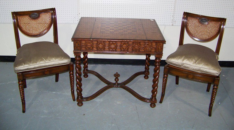 Theodore Alexander Games Table & 2 Cain Back Chair: Theodore Alexander Games Table & 2 Cain Back Chairs. Great Game table in a Chinese Chippendale style with 2 drawers & slide top game board to expose backgammon table. Table is app 31" tall 34"x27" top