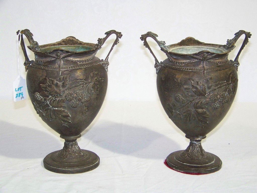 Antique Dragonfly & Floral Bronze Urn Planters: Pair of Antique Dragonfly & Floral Bronze Urn Planter's. Each has a Dragonfly on both sides above a great Berry & Leaf design on Urn sides and base.Looks to have been silver plated over bronze. Each s