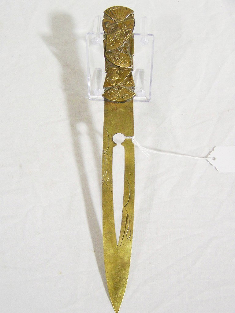 Early Japanese Ornate Letter Opener/Paper Knife: Early Japanese Ornate Letter Opener/Paper Knife. Has a cut out in blade with floral carvings, handle is raised fans on each side with flowers and birds. Knife is 10 3/4" long