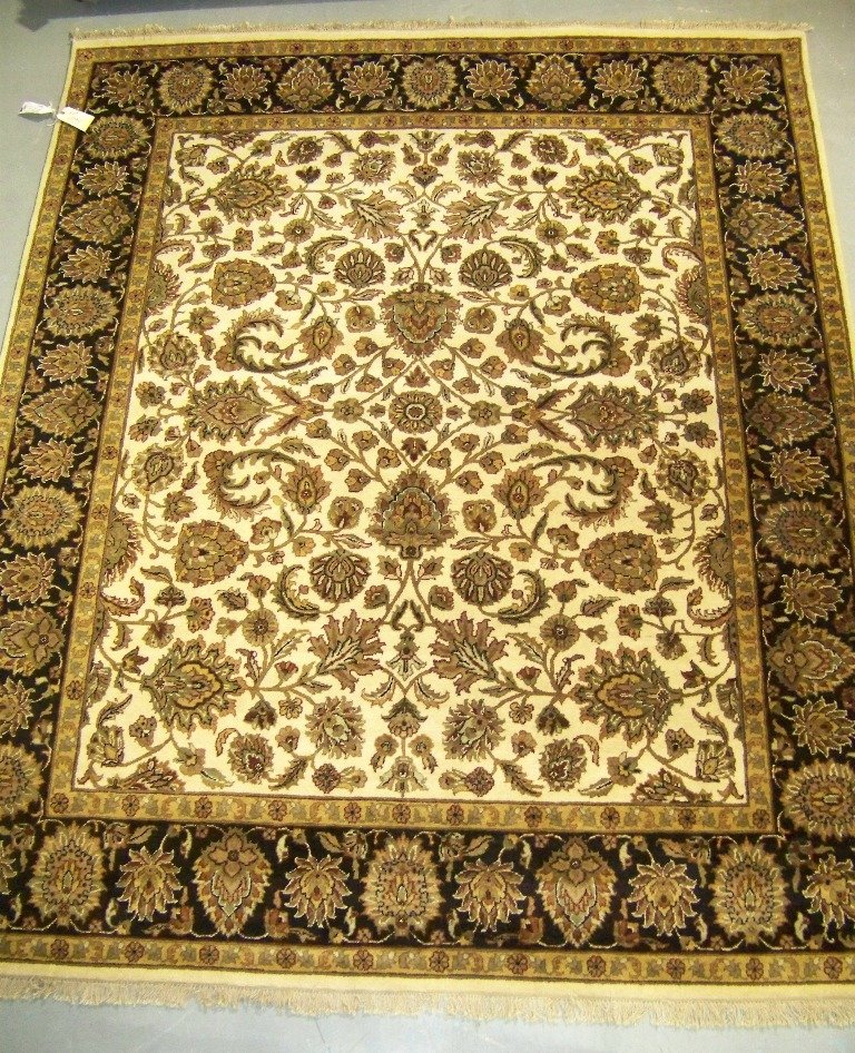 Vintage India Agra Wool Pile Rug 10' x 8': Vintage India Agra Wool Pile Rug 10' x 8'. Has a cream border & center field, with black,brown,burnt red and others.