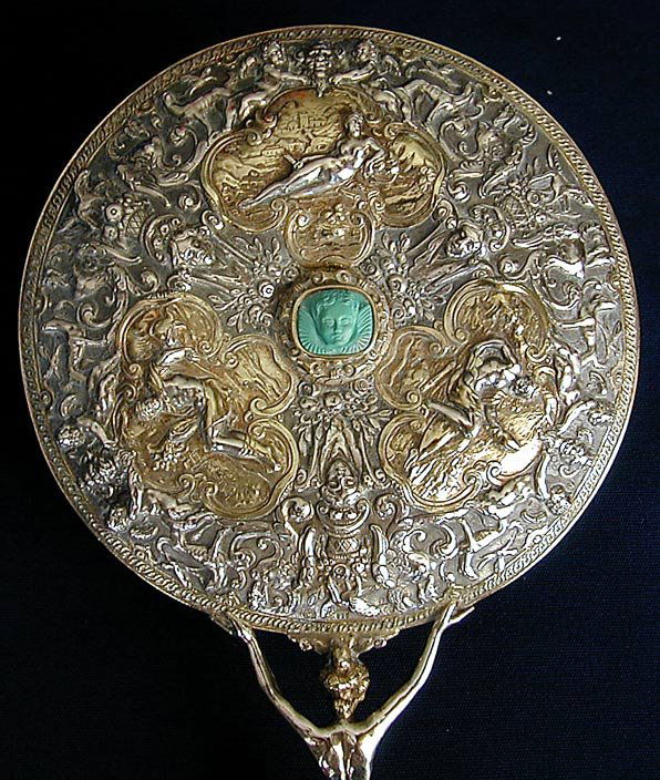 RARE 19THC TH. HEIDEN SILVER & TURQUOISE HAND MIRR: An exceptional woman's hand mirror designed in the 19thc by the renowned German silversmith firm of THEODOR HEIDEN; opulent in form and use of materials, the handle is a sculpted draped nude female wi