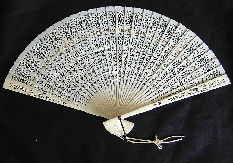 OLD CHINESE IVORY FAN: This is an old reticulated Cinese ivory fan. It is 12" x 7 1/2" and in very good condition.