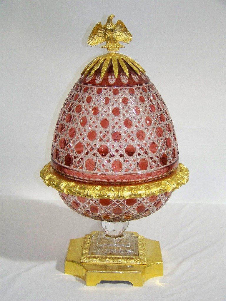 20th C. Russian Dore Bronze & Crystal Egg Shaped Bo: 20th C. Russian Dore Bronze & Crystal Egg Shaped Covered Bowl. Great large 24" tall Eagle top lidded Egg shaped center pc. bowl. Great bronze supports, glass is cranberry and clear. Total height is ap