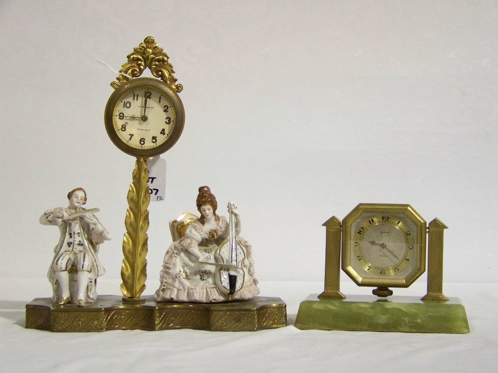 Antique Elgin Onyx Clock & New Haven Figural Clock: Antique Elgin Onyx Clock & New Haven Figural Clock.Great early Elgin Onyx based clock standing app.4" tall & 5 1/2" long,and a figural New Haven clock standing app.9 1/2" tall and app.8 1/2" long.