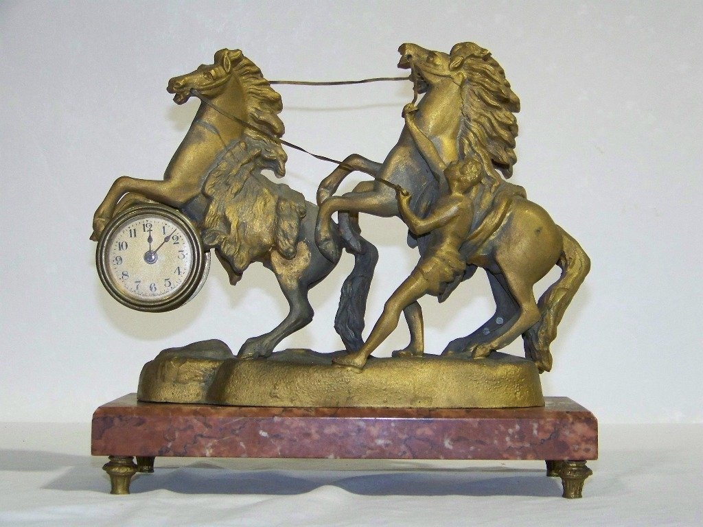 Early French Signed White Metal Rearing Horse Cloc: Early White Metal Rearing Horse Clock on a marble base. Has three horses and a man trying to hold the horses.Has a French foundry stamp and signed in the metal.Stands app.10" tall and on a 11" x 5" fo