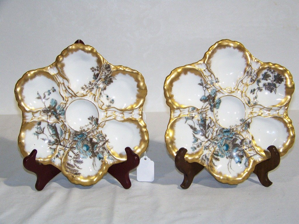 Antique Hand Painted Haviland Limoges Oyster Plates: Antique Hand Painted Haviland Limoges Oyster Plates. A great pair all hand painted with flower's with a gold boarder. Each is app.9" across.