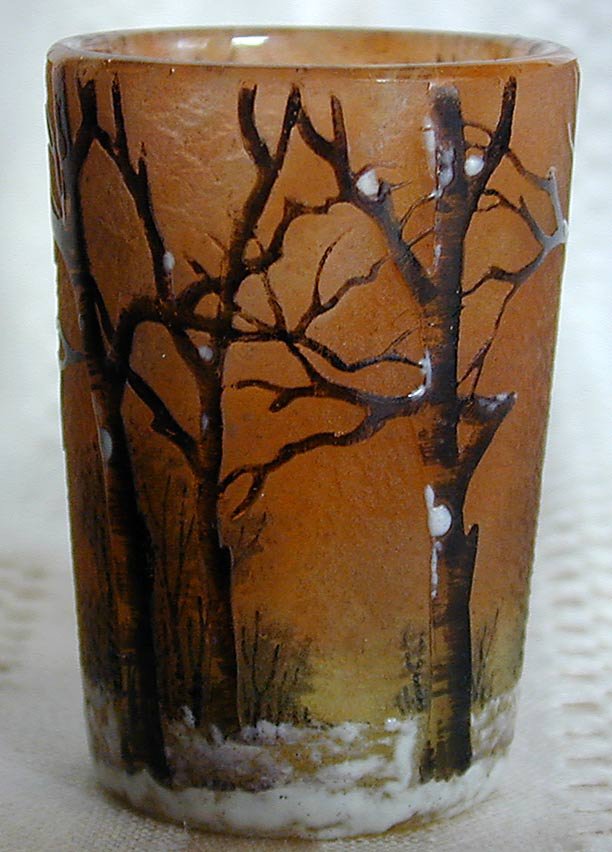 DAUM NANCY ENAMELLED SCENIC SNOW FOREST VASE: A DAUM NANCY art glass vase enamelled with a design of a snow-covered forest scene; 2"H; very good condition with no chips, cracks or restorations.