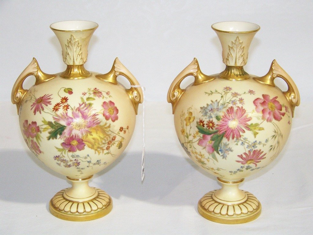 Pr. Antique Royal Worcester Double Handled Vases: Pr. Antique Royal Worcester Double Handled Vases. Both Hand painted with floral and each is app.9" tall and app.7" wide.