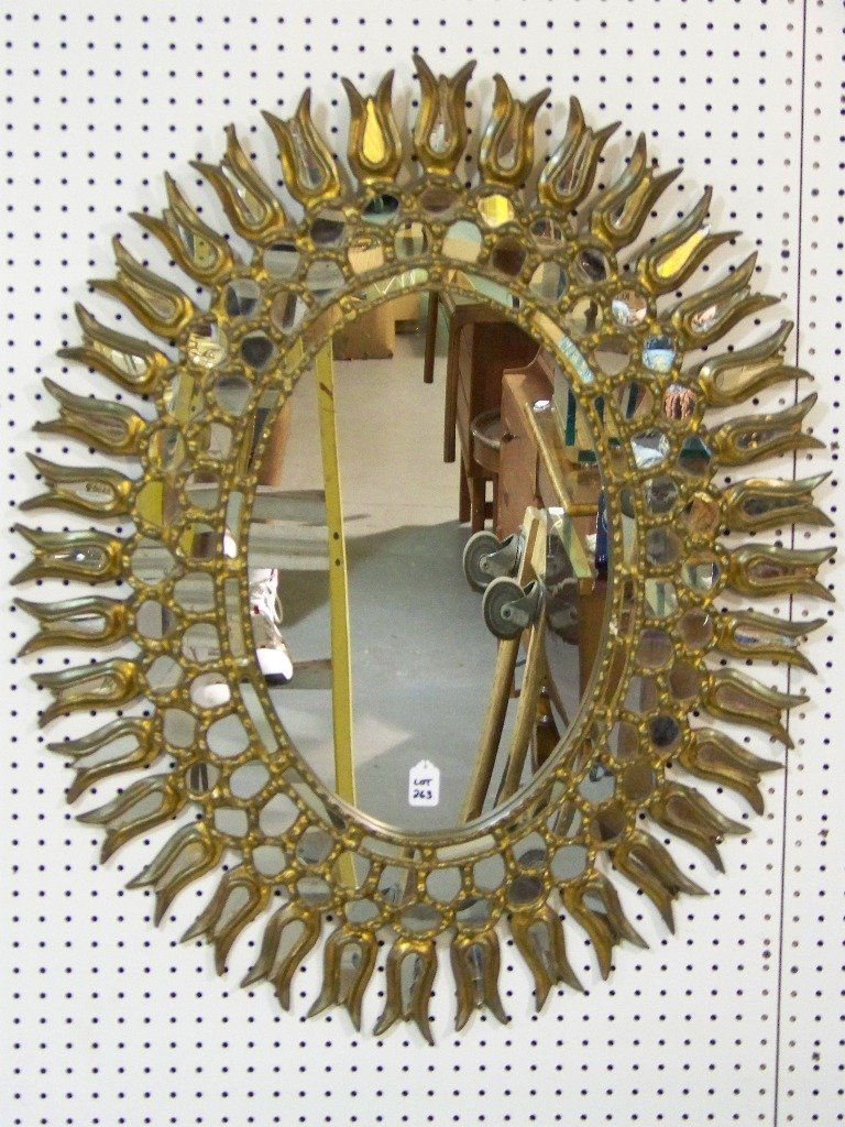 Fine Italian Florentine Gilded Sunburst Style Mirr: Fine Italian Florentine Gilded Sunburst Style Mirror. Great mirror with many smaller mirrors surrounding outer boarder of mirror ( some with cracks as shown).Stands app.38" tall and app.32" wide.