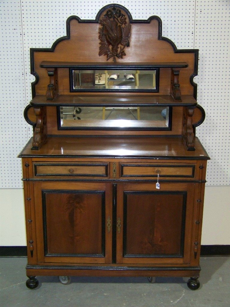 19th C. German Black Forest Mirrored Back Sideboa: 19th C. German Black Forest Mirrored Back Sideboard. Fine carved two part Black Forest Sideboard with a fine carved Bird (Pheasant?).Has two large doors under two drawers, with two shelves on top.Stan