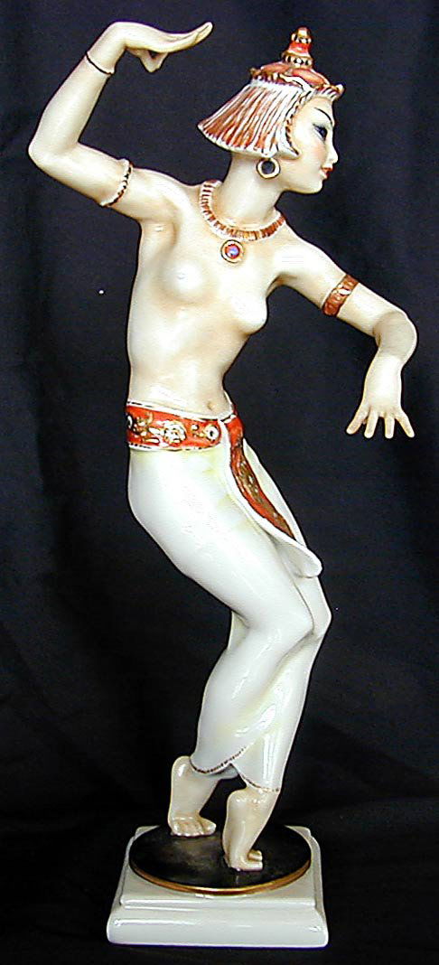 SEXY ART DECO HUTSCHENREUTHER BALI DANCER: A porcelain figurine by Hutschenrueuther Germany designed and signed (see pic) by Carl Werner as a sexy bejeweled Balinese female dancer, standing 11.25"H with full marks underneath (see pics); good c
