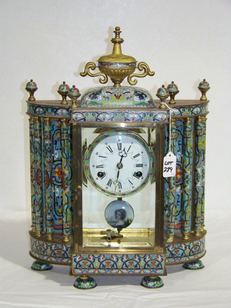 Vintage Chinese Cloisonne Enamel Clock: Vintage Chinese Cloisonne Enamel Clock.Great Clock with Cloisonne throughout,Has enamel face and pendulum. Stands app.18" tall,13 1/2" wide and 6" deep resting on four feet.