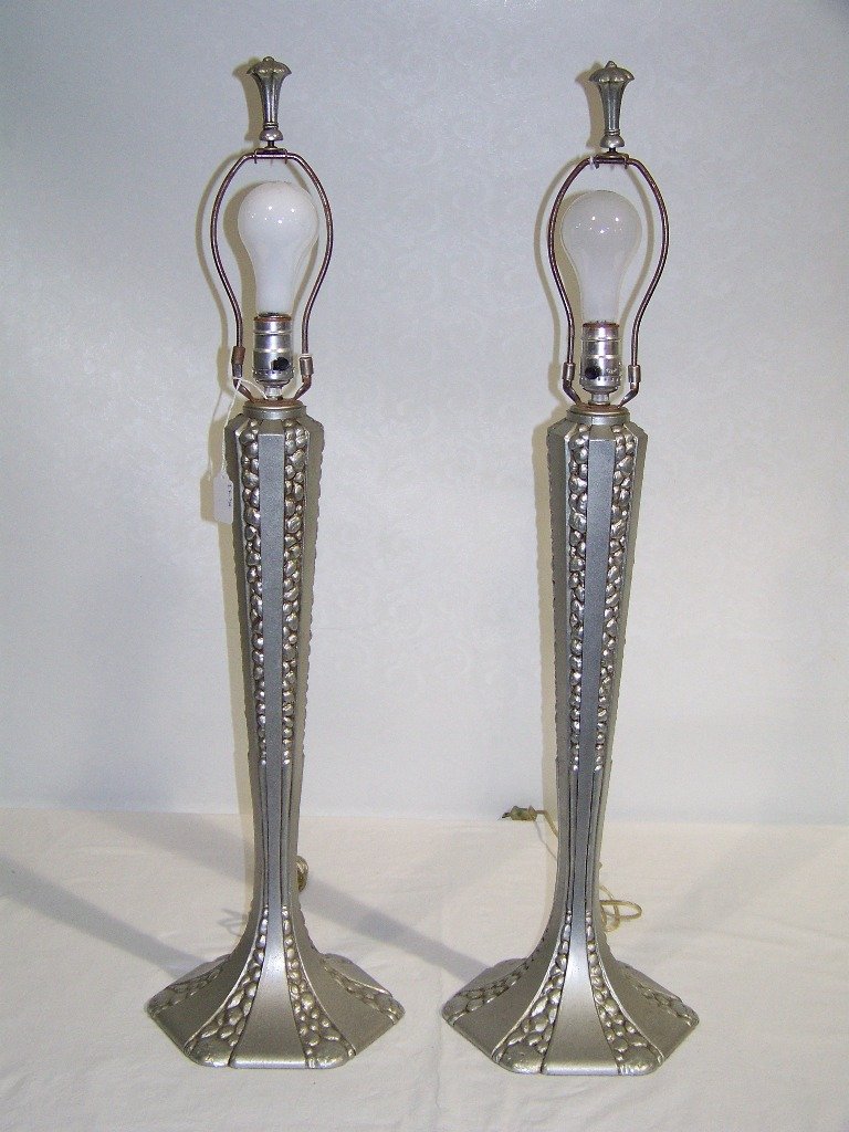 Pair of Art Deco Style Cast Metal 33" Table Lamps.: Pair of Art Deco Style Cast Metal 33" Table Lamps.Looks to might be Aluminum or a white metal. Each is app 33" tall to top of harps, 22" tall to top of lamp.