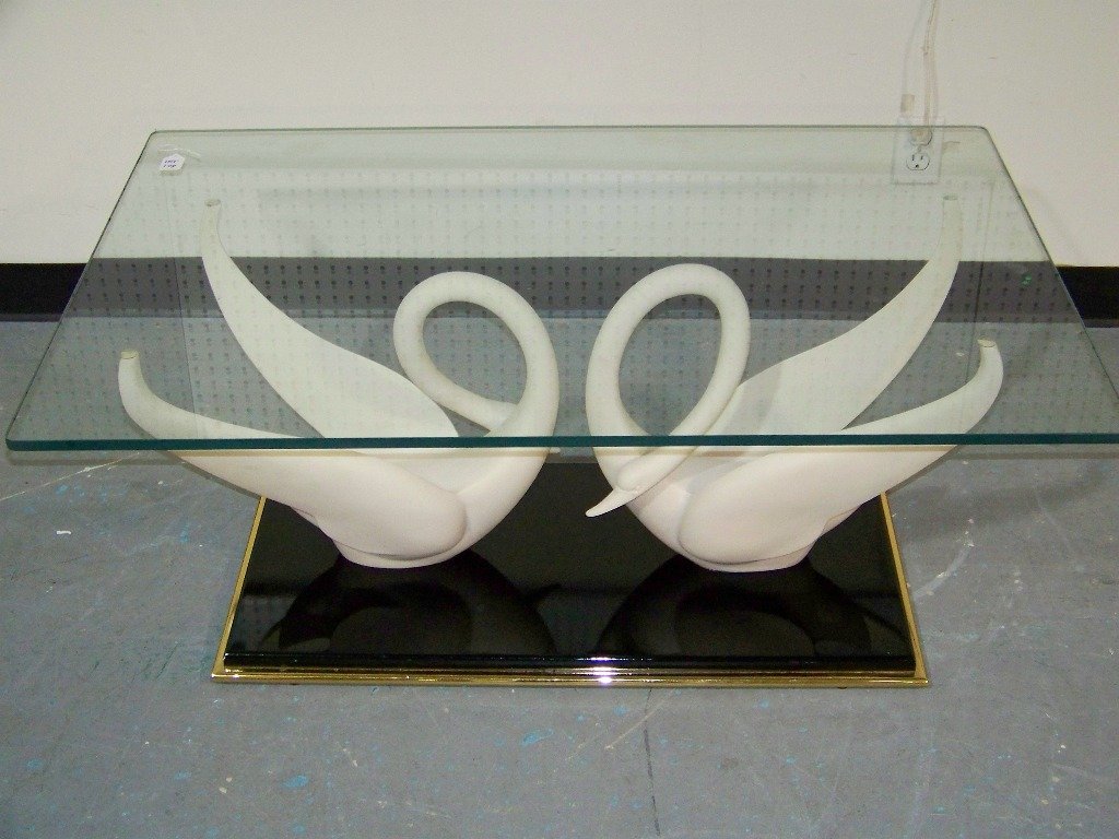 Maison Jansen Signed Double Swan Based Coffee Table: Maison Jansen Signed Double Swan Based Coffee Table. A fine table with double Swans on a lacquer base standing app.17" tall, with a 43" x 29" wide glass top.