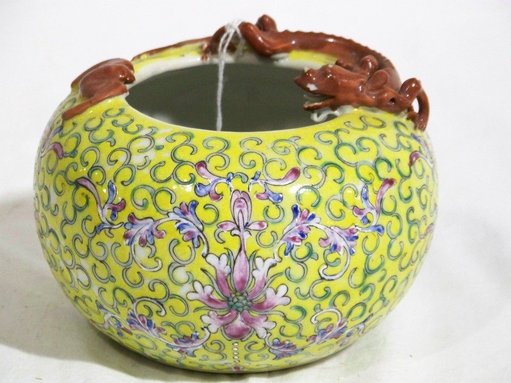 Vintage Chinese Signed Yellow Dragon & Bat Pot: Vintage Chinese Signed Yellow Dragon & Bat Pot. A fine pc. with a Dragon or Lizard at rim of bowl with a Bat on other side. Has a yellow background with flowers. Stands app.4" tall and app.5 1/2" acro