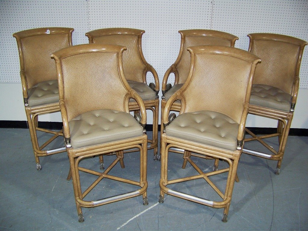 Set of 6 Leather Wrapped Wicker Woven Bar Stools: Set of 6 Leather Wrapped Wicker Woven Bar Stools.Each has a scrolled pewter colored metal arm base also metal foot rest. Each is app.47" tall and 23" wide app. 29" deep.All have arms.All have a leathe