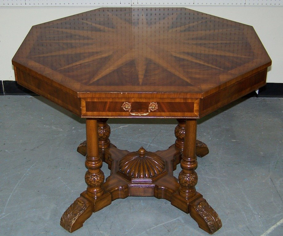Maitland Smith Star Burst Inlaid Center Table: Maitland Smith Star Burst Inlaid Center Table. Great inlaid table with octagonal shaped top with four drawers resting on four carved center support posts and on four feet. Table is app.29" tall and ap