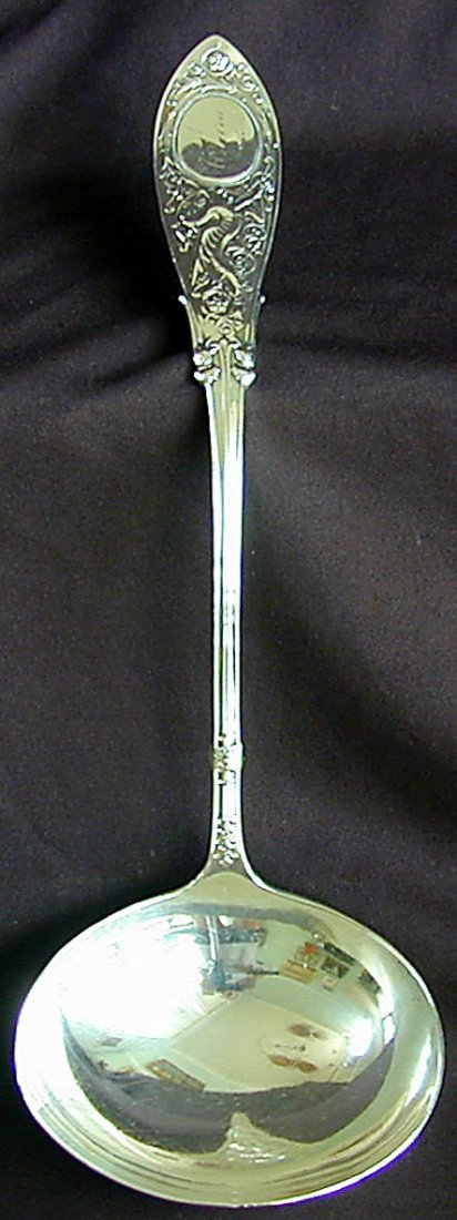 19th C. WHITING STERLING LADLE 4 1/2 OZ: This is a circa 1875 sterling silver Whiting ladle. It is in the Arabesque pattern designed by Charles Osborne. It is 11" long and 4 1/2 troy ozs. It is in very good condition and is monogrammed.