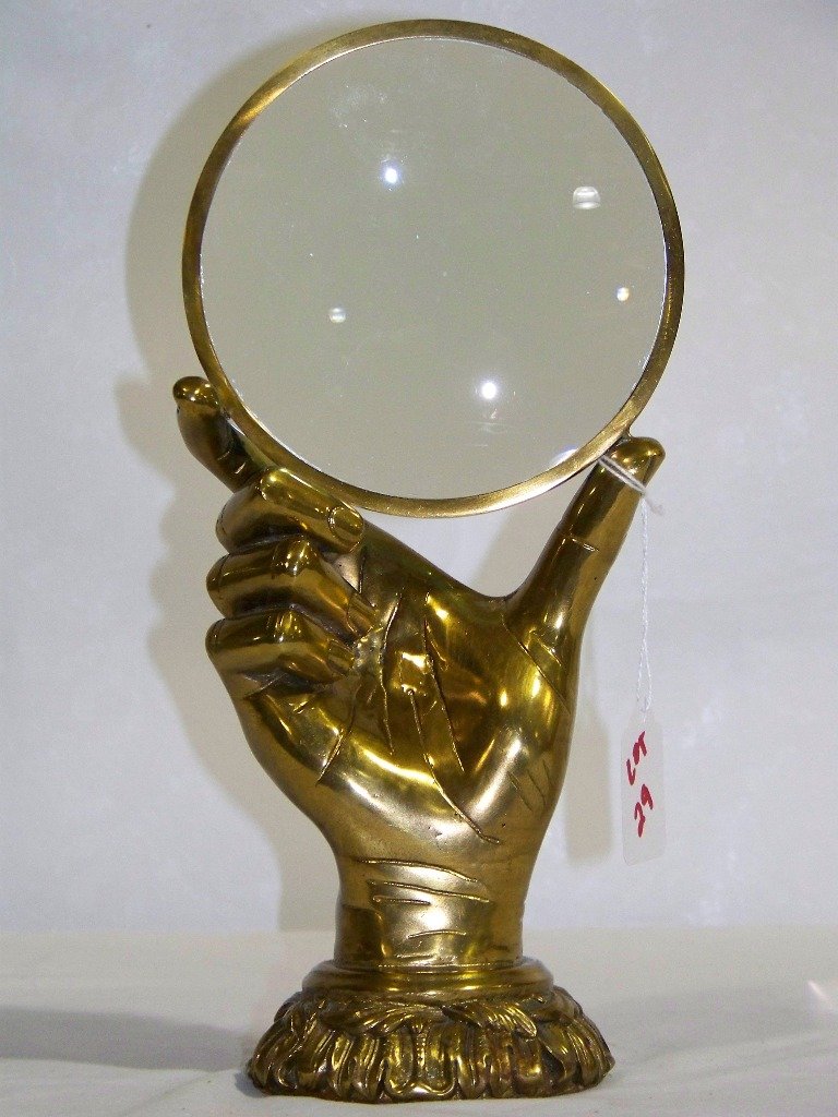 Fine Vintage Ornate Bronze Hand Shaped Magnify Glass: Fine Vintage Ornate Bronze Hand Magnify Glass. A great pc. shaped in the shape of a Hand holding a large magnify glass, stands app.11 1/2" tall and app.6" wide resting on a ornate base.