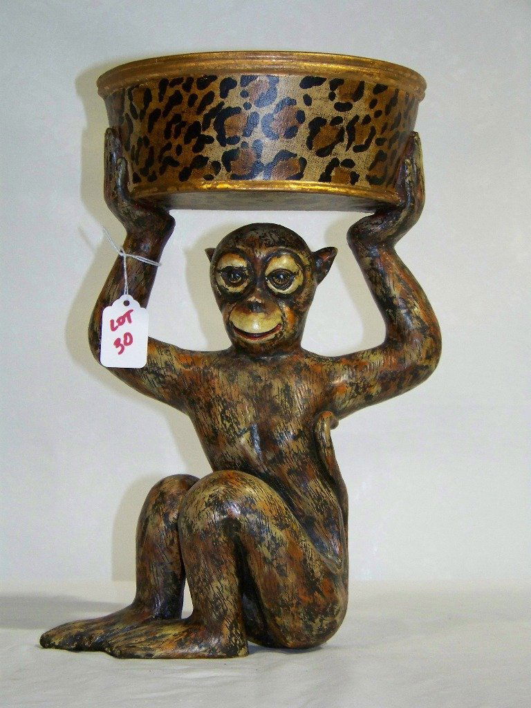 20th C. Carved Monkey Wall Shelf / Wall Bracket: 20th C. Carved Monkey Wall Shelf / Wall Bracket. Nice detail of a Monkey holding basket above his head. Stands app.14" tall and app.8" wide.Made out of a Composite style material possible resin.