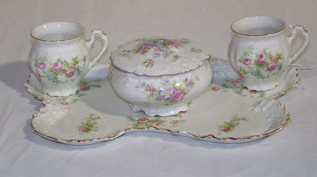 Early 4 Pc. M.Z. Austrian Porcelain Dresser Set: Early 4 Pc. M.Z. Austrian Porcelain Dresser Set.Circa 1910 Artist Moritz Zdekauer with PINK ROSES,DEPOSE Signed MZ Austria.Great set with a 10 1/2" x 9" tray a lidded box and two handled cups.