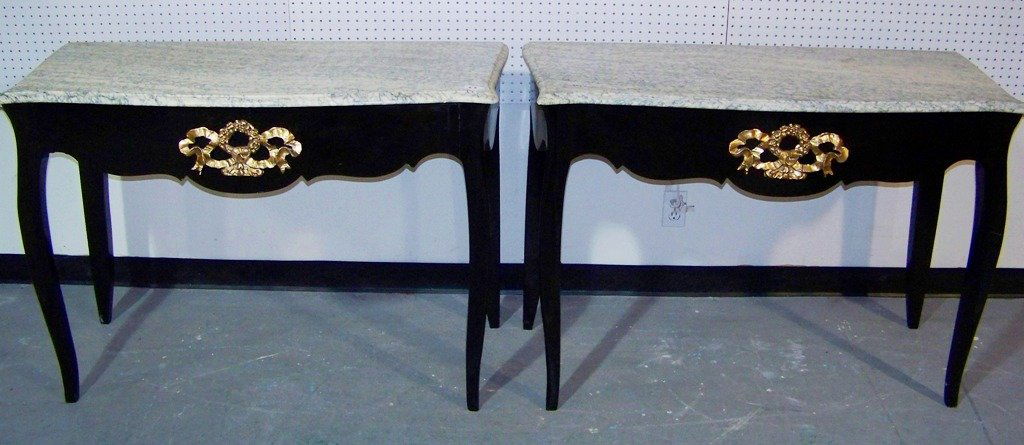 Pair Early Italian Marble Top Console Table's: Pair Early Italian Marble Top Console Table's. Each has a bronze mount of a wreath with ribbon.Each is a black lacquer and each is app.33" tall and app.47 1/2" wide and app.21" deep.
