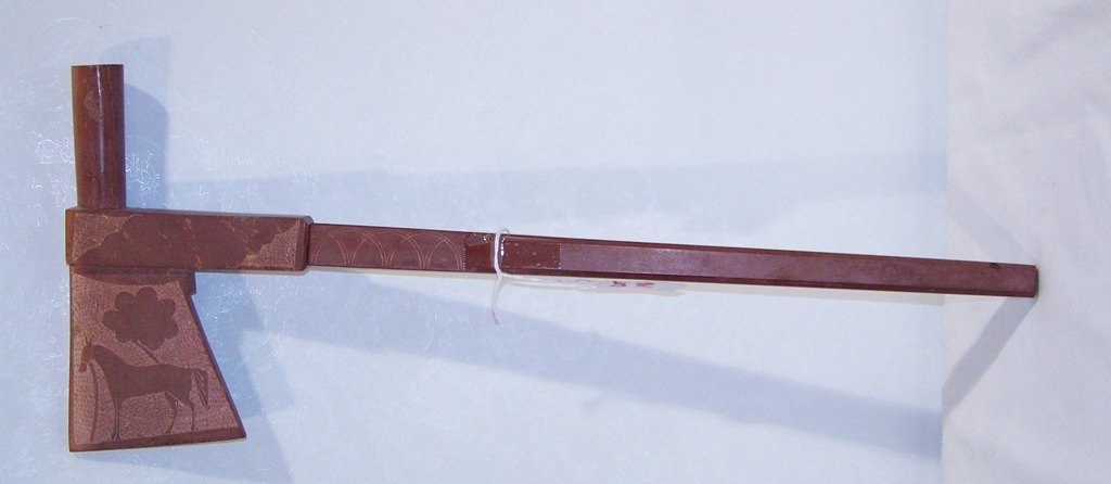 Vintage Indian Soapstone Carved Pipe Tomahawk: Vintage Indian Soapstone Carved Pipe Tomahawk. Has carving of a Horse to both sides.Comes apart an is app.17" tall and app.7" across Tomahawk.