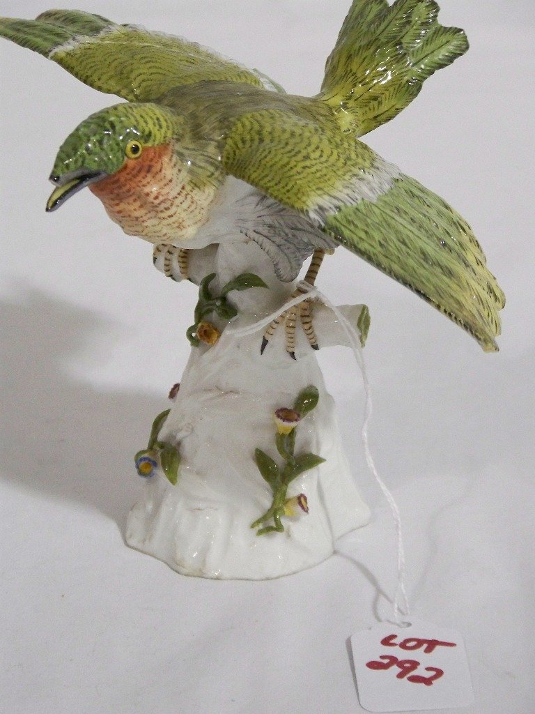 Antique Meissen Porcelain Bird: Antique Meissen Porcelain Bird. Great porcelain bird on a tree with small flowers around sides of tree trunk.Bird stands app.5 1/2" tall and app.7 3/4" wide.Has old repair and loss to beak as shown an