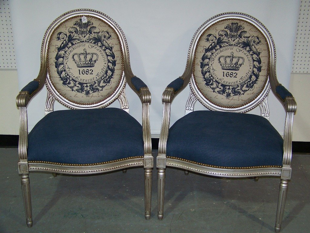 Pair French Balloon Back Silver Gilt Arm Chairs,Fauteui: Pair French Balloon Back Silver Gilt Arm Chairs,Fauteuil. Great pair of Silver gilded arm chairs with a fabric copy of the shield of 1662 with nail heads throughout. Each is app.41" tall,27" wide and 