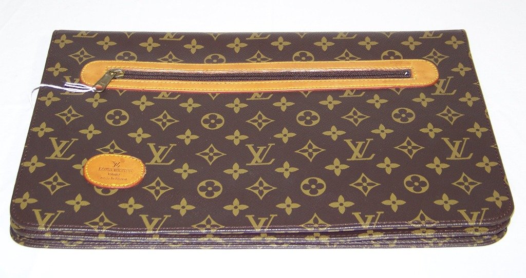 Louis Vuitton Laptop Clutch Bag: Louis Vuitton Laptop Clutch Bag.Bag has a zipper pocket on front also on inside with a pen holders and other sleeve style compartment. Bag is app.15" wide and app.9 3/4" tall.