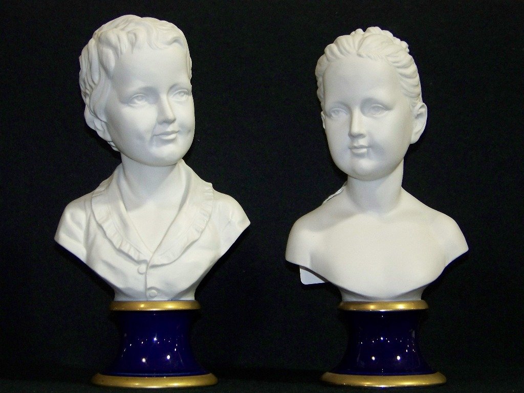 Pair Vintage Signed "Pucci" Porcelain Busts By KPM: Pair Vintage Signed "Pucci" Porcelain Busts By KPM.Each signed,one of a young boy and other of girl.Each is app.12" tall and app.6 1/2" wide.