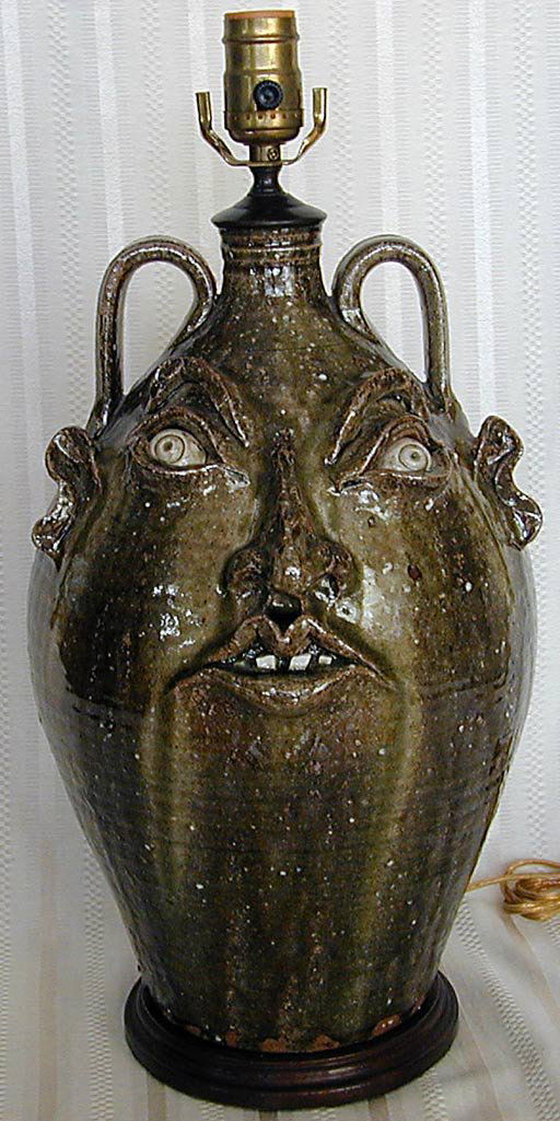 ELLINGTON Face Jug, North Carolina pottery: This is a decorated pottery Face Jug by North Carolina artist Kim Ellington. It is mounted as a lamp. The jug itself is 15 1/4" high and signed upper back. It is in very good condition with no chips,