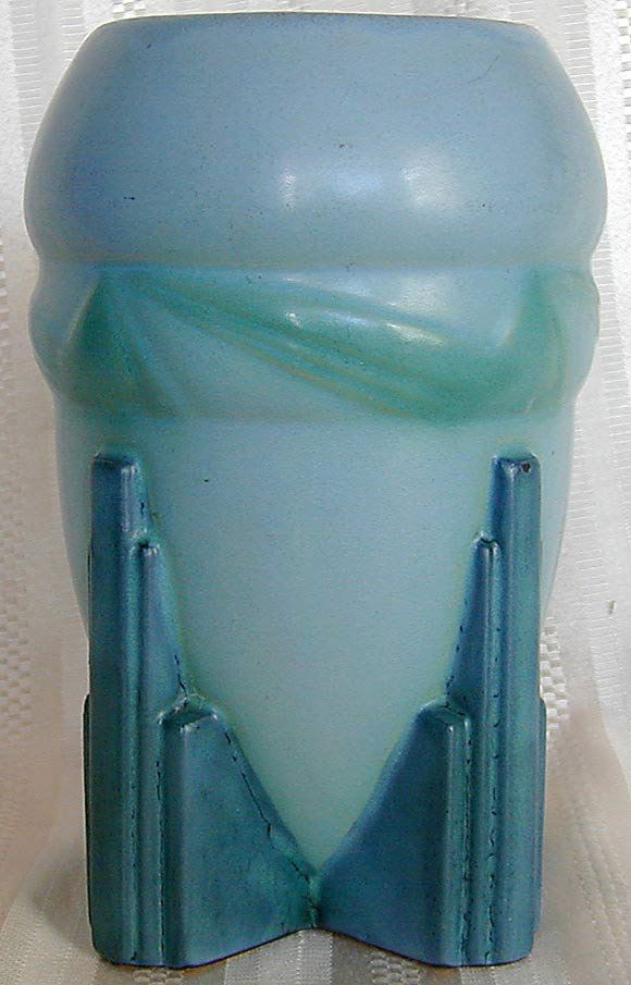 ROSEVILLE FUTURA "ROCKET SHIP" Vase 8" H.: This is a fine Roseville futura "Rocket Ship". It is 8" high and in very good condition with no chips, cracks or repairs. The rocket ship shaped vase has deep blue buttresses and a multicolored band w