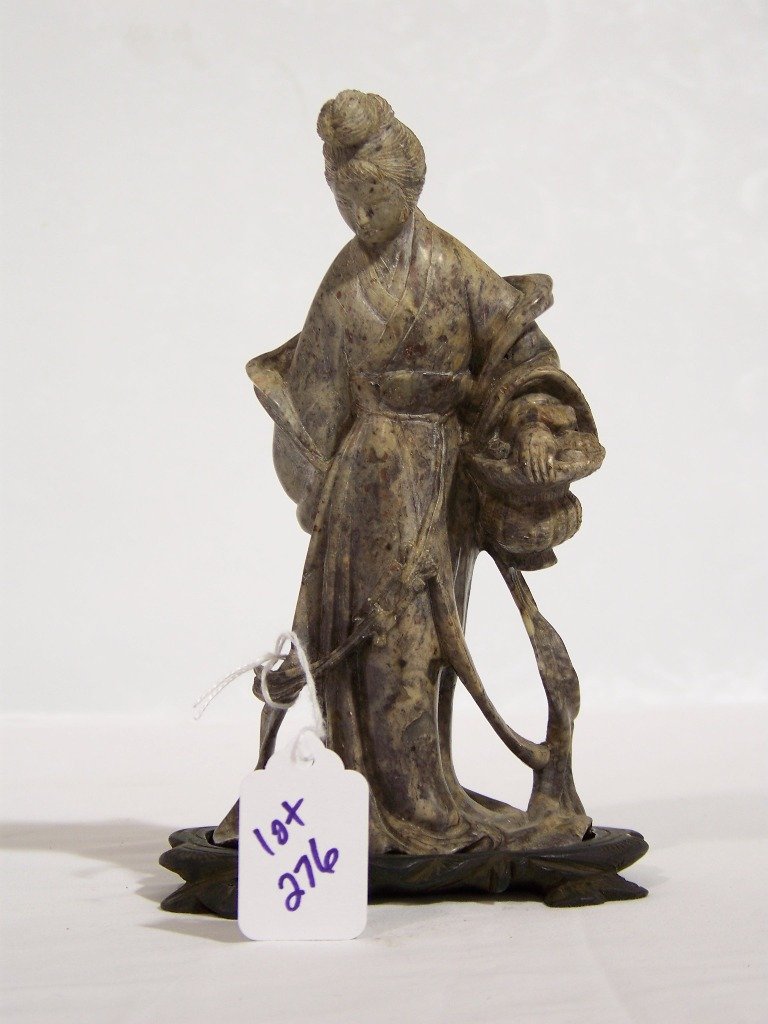 Early Chinese Fine Carved Soapstone of Quan Yin: Early Chinese Fine Carved Soapstone of Quan Yin.Great carved figure of a female with a long rode and carrying basket. Figure is app.7" tall, in a fitted wooden carved base is app.7 1/2" tall.