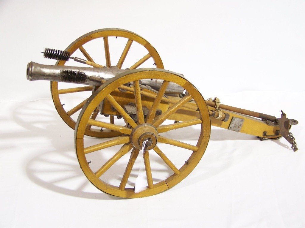 Vintage Civil War Style Cannon: Vintage Civil War Style Cannon. Great small scale Cannon with metal capped wheels. Cannon has everything,push rods,ammo boxes and etc.Stamped Spain on base.App.28 1/2" long and app.13" wide and 11 1/2