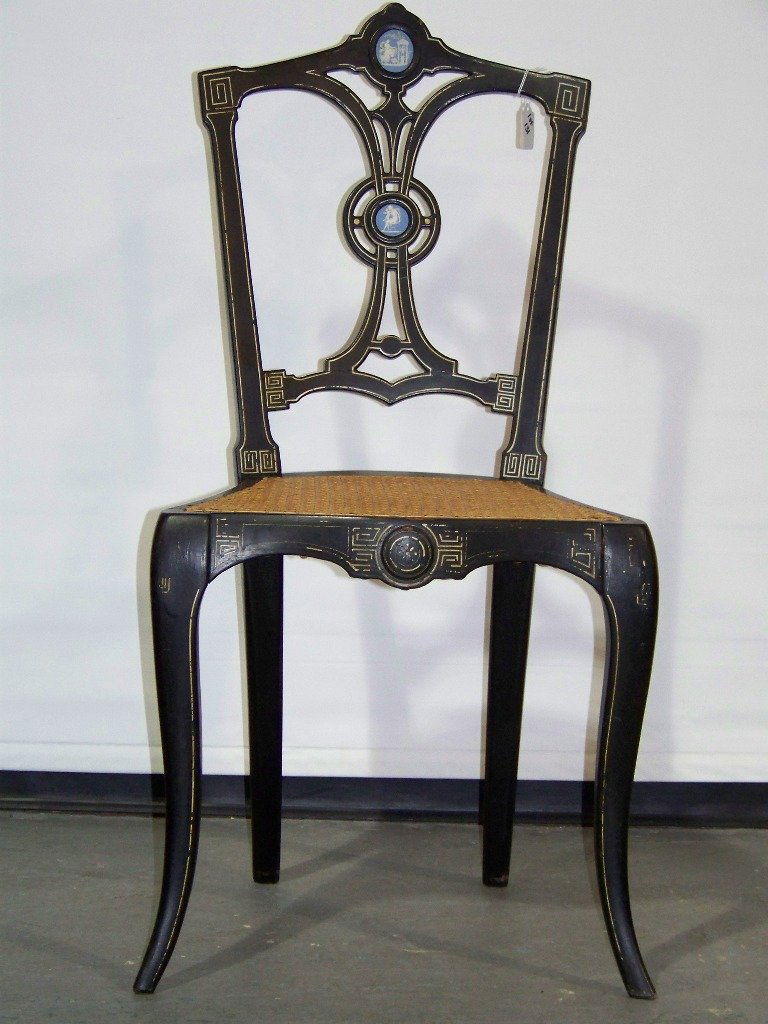 Victorian Ebonized and Wedgwood Mounted Lacquered Chair: Victorian Ebonized and Wedgwood Mounted Lacquered Side Chair, openwork backrest, caned seat and turned legs.Stands 34" tall,17" wide and 17 1/2" deep.Has partial label on base.