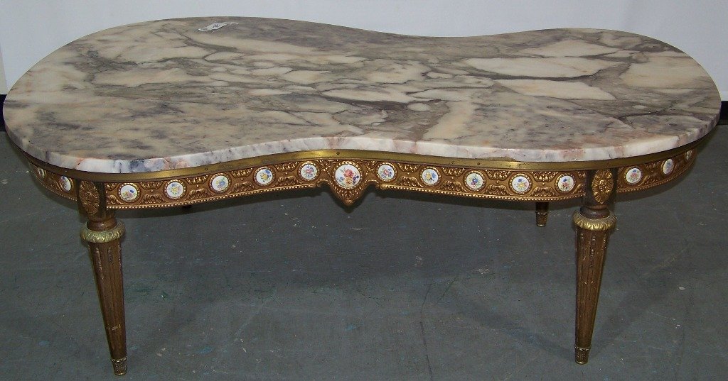 Early French Marble Top Porcelain Insert Coffee Table: Early French Marble Top Porcelain Insert Coffee Table. Great kidney shaped marble top coffee table.Has Bronze mounts on legs and around band that has many Limoges style porcelain medallions.Table is a