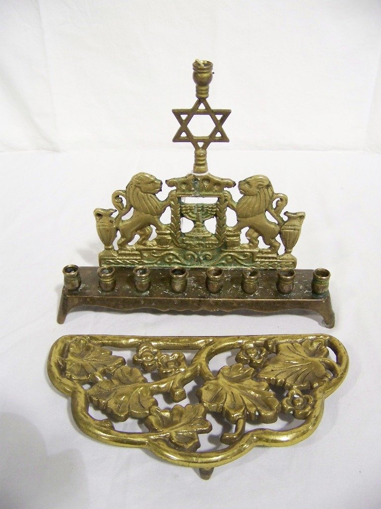 Early RCY Brass Menorah & Harvin Brass Trivet: Early RCY Brass Menorah & Harvin Brass Trivet. Menorah has Lion mounts and Star of David at top and is stamped RCY on base.(7 1/2" x 9" long).Trivet is 8 1/2" long and stamped Harvin on base.